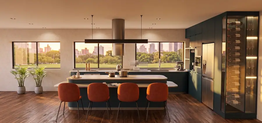 Cocina loft con isla, sillas terracota y vista al parque